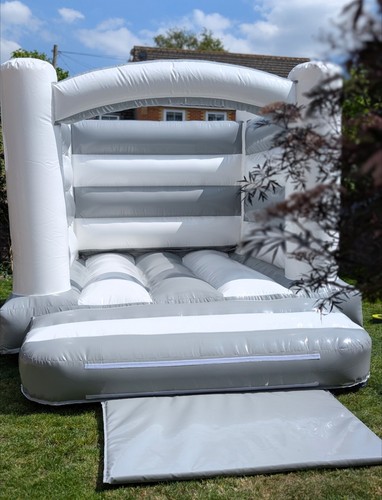 Grey and white bouncy castle - and,